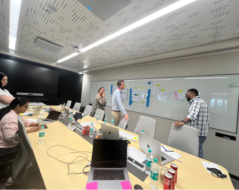 Team planning at a whiteboard in a meeting room